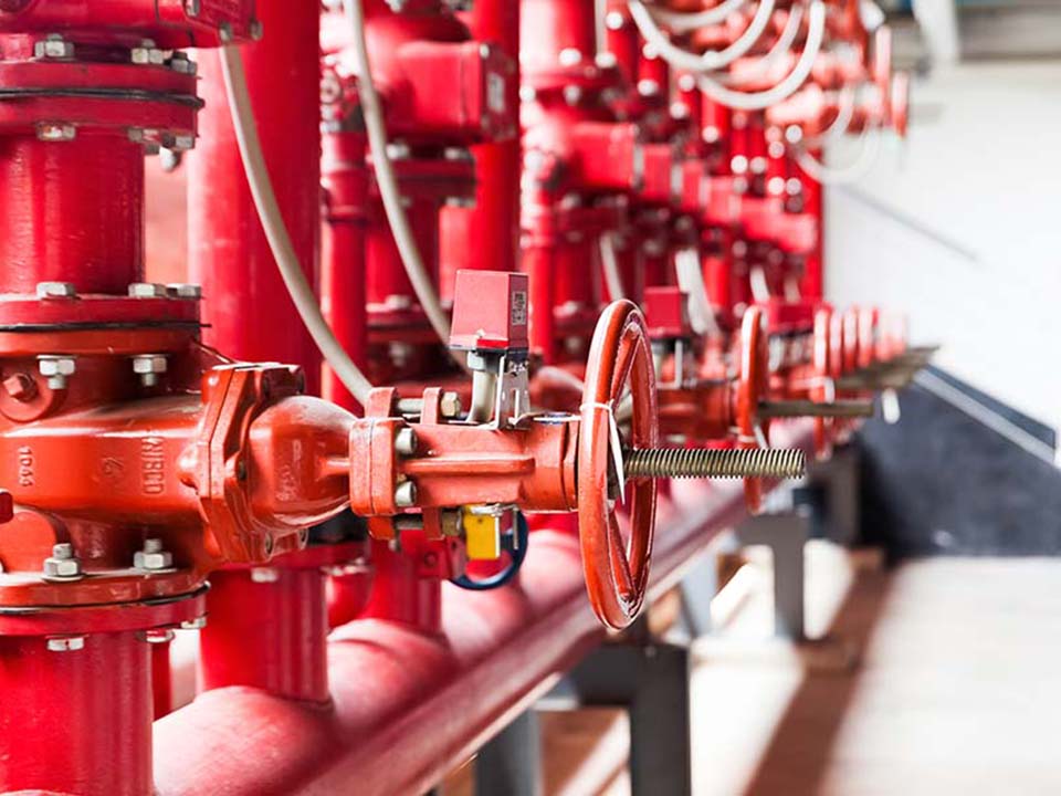 A row of red color fire fighting water supply pipeline system