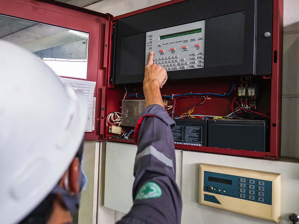 Technician Checking doing work Maintenance fire alarm system in a factory Fire protection Factory safety Qiao Shan Installation control detector emergency risk