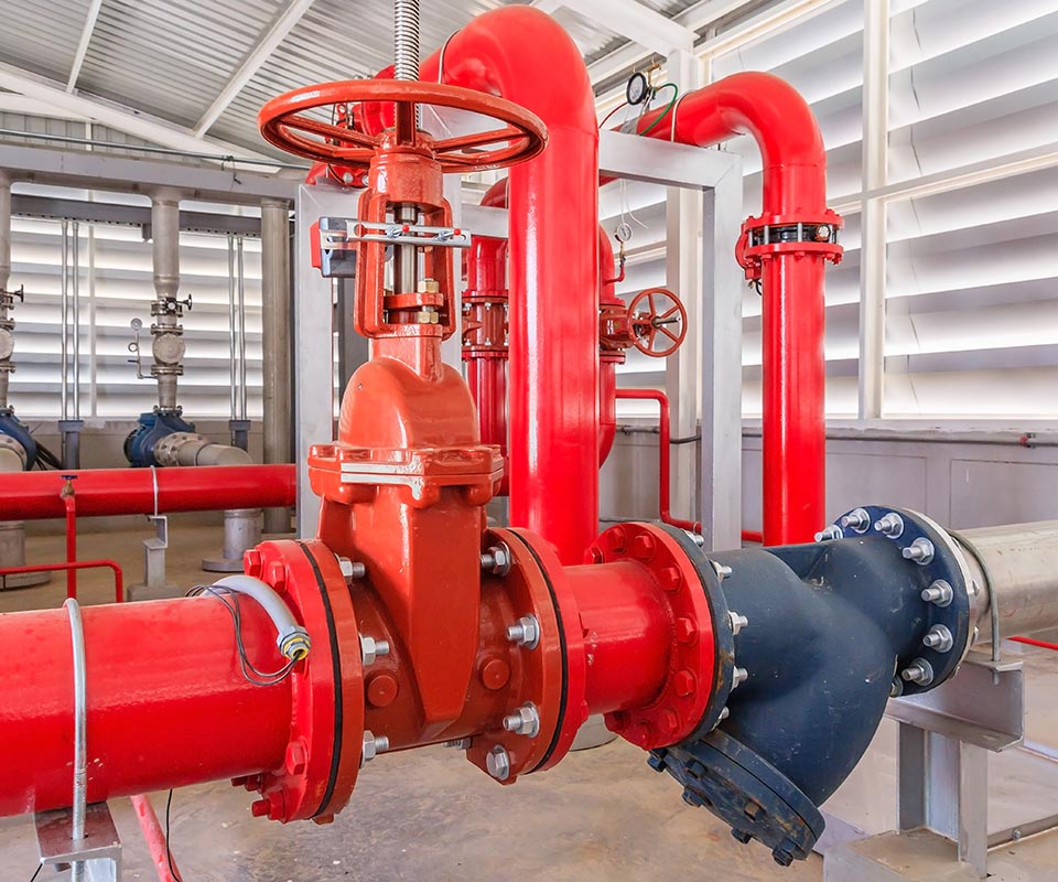 Industrial fire pump station for water sprinkler piping and fire alarm control system. Pipelines, water pump, valves, manometers.